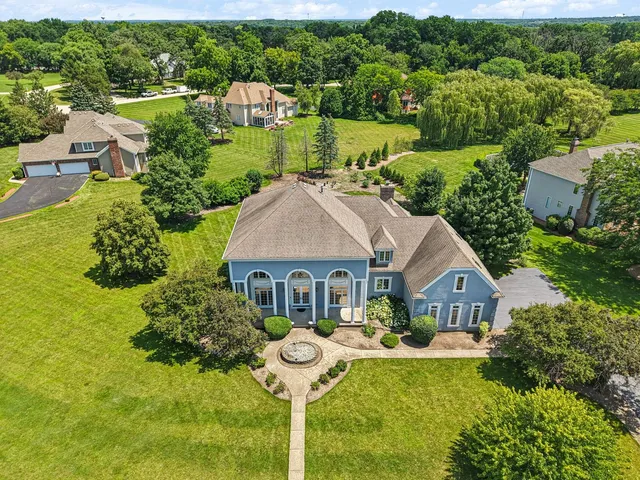 a view of a house with backyard and porch