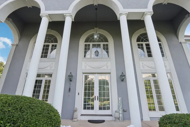 a view of an entryway with wooden floor