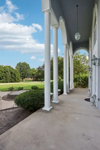 a kitchen with a stove a sink a counter space and a window