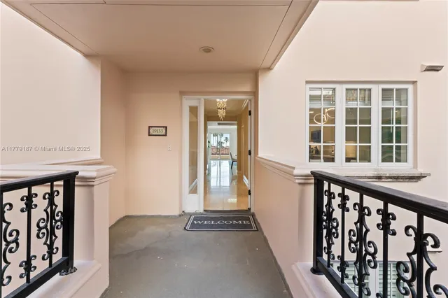 a view of a hallway with a chandelier