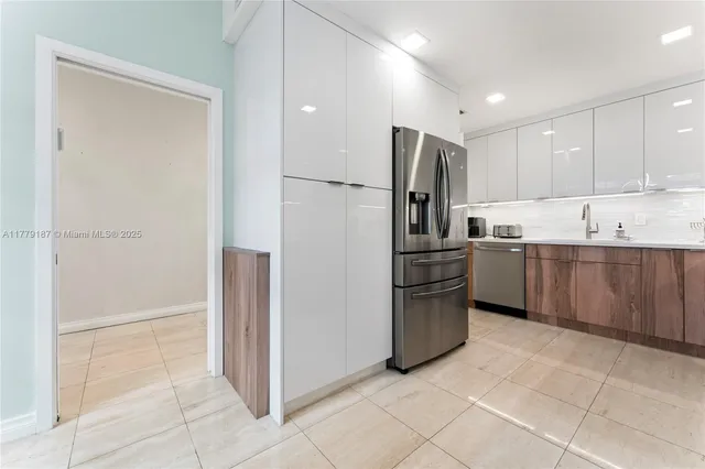 a kitchen with a stove a sink and a microwave