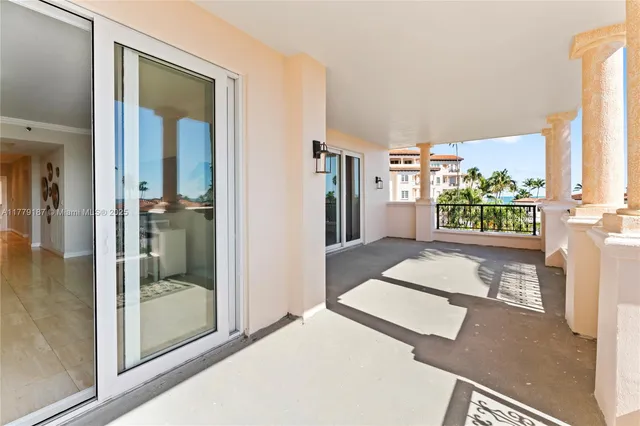 a view of a balcony with wooden floor