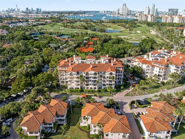 an aerial view of residential houses with outdoor space and street view