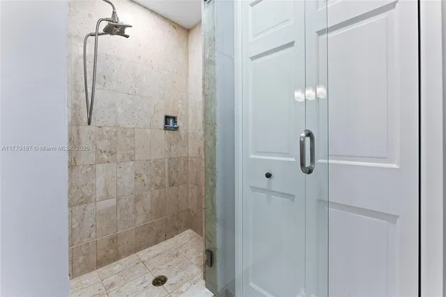 a spacious bedroom with a large bed and a window