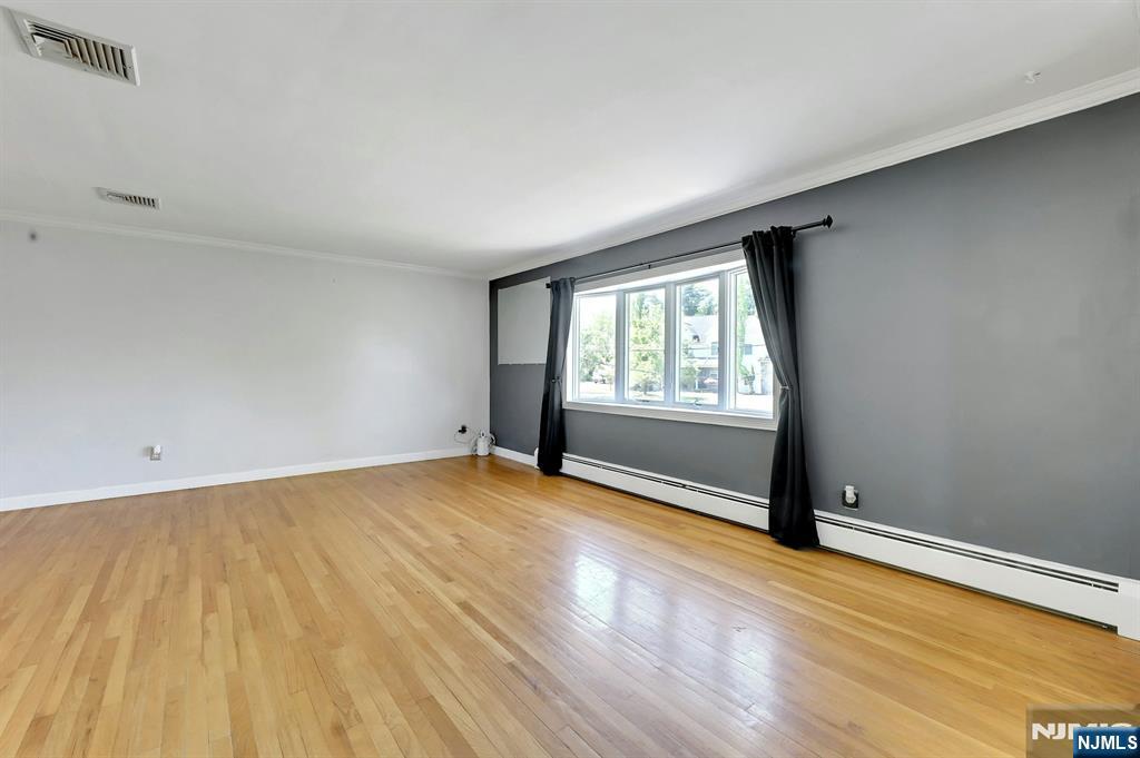 20 Blue Hill Road Norwood, NJ 07648 - Photo 5 of 49 an empty room with wooden floor and windows