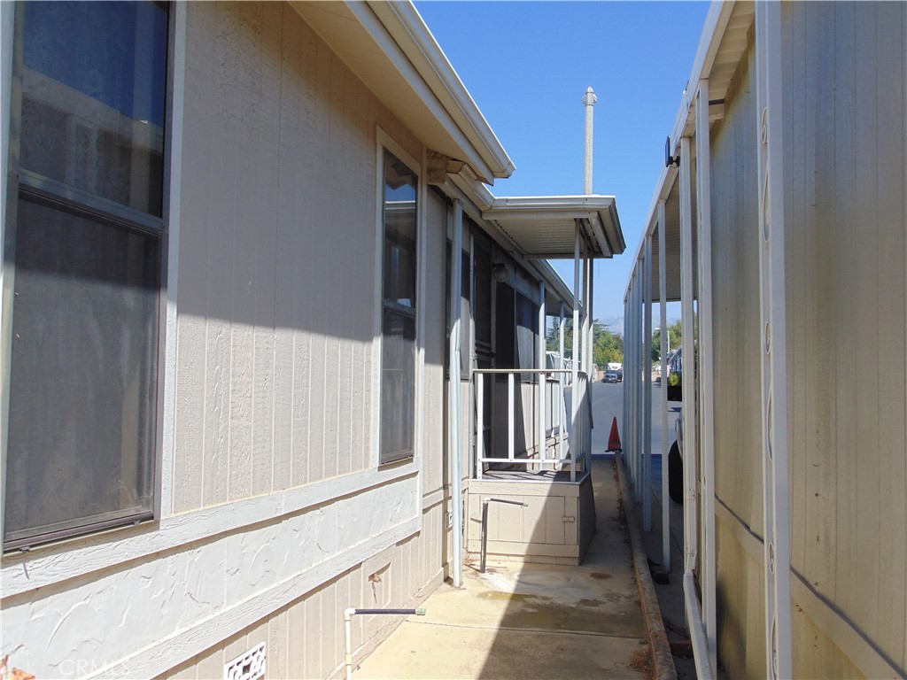 12618 3rd Street, Unit 63 Yucaipa, CA 92399 - Photo 13 of 70 side entrance for enclosed porch/bedrrom 3
