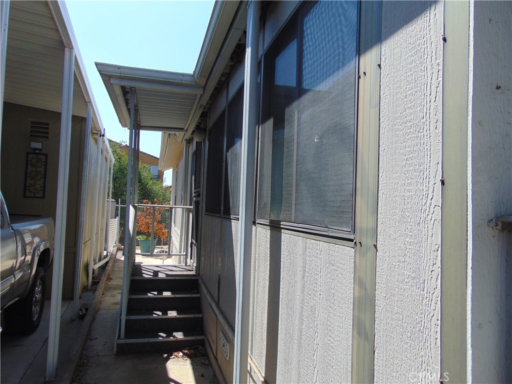 12618 3rd Street, Unit 63 Yucaipa, CA 92399 - Photo 14 of 70 side entrance for enclosed porch/bedrrom 3