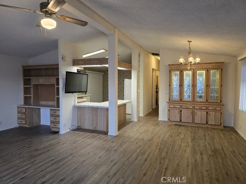 12618 3rd Street, Unit 63 Yucaipa, CA 92399 - Photo 15 of 65 a view of a living room kitchen and a wooden floor