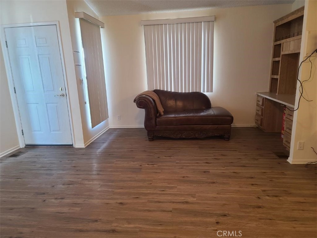 12618 3rd Street, Unit 63 Yucaipa, CA 92399 - Photo 18 of 65 a living room with furniture and a flat screen tv