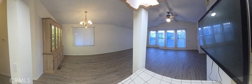 12618 3rd Street, Unit 63 Yucaipa, CA 92399 - Photo 21 of 65 wooden floor in an empty room with a mirror