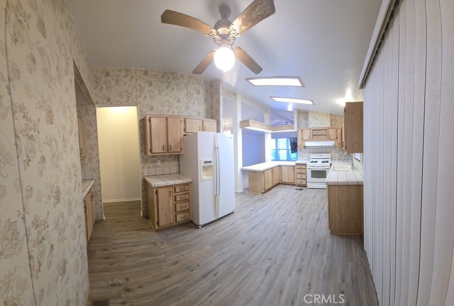 12618 3rd Street, Unit 63 Yucaipa, CA 92399 - Photo 22 of 65 a kitchen with a refrigerator and a sink