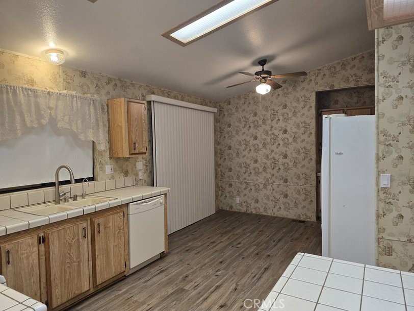 12618 3rd Street, Unit 63 Yucaipa, CA 92399 - Photo 24 of 65 a bathroom with a sink a mirror and a shower