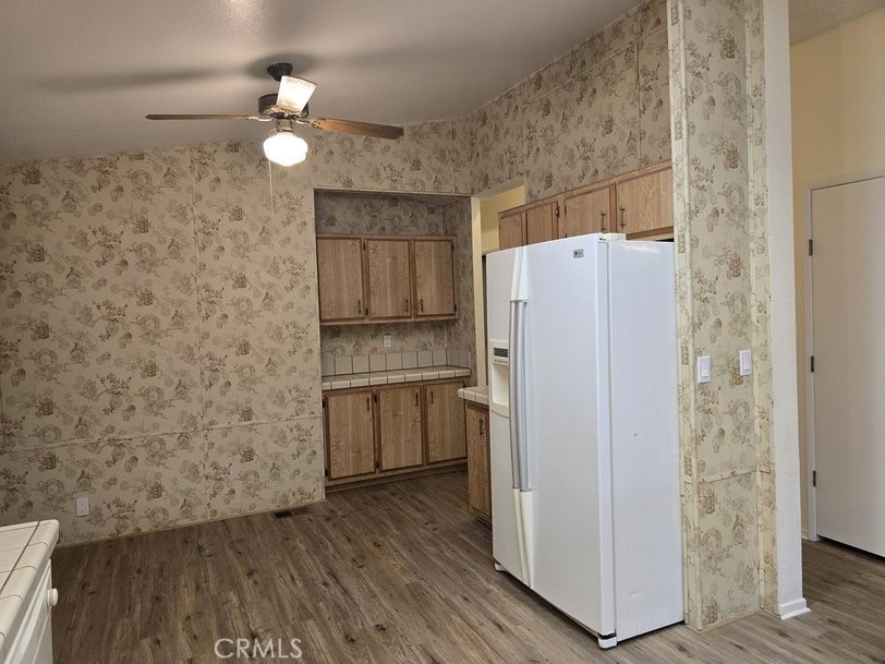 12618 3rd Street, Unit 63 Yucaipa, CA 92399 - Photo 25 of 65 a white refrigerator freezer sitting inside of a kitchen