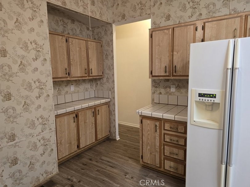 12618 3rd Street, Unit 63 Yucaipa, CA 92399 - Photo 26 of 65 a kitchen with stainless steel appliances a refrigerator and a stove