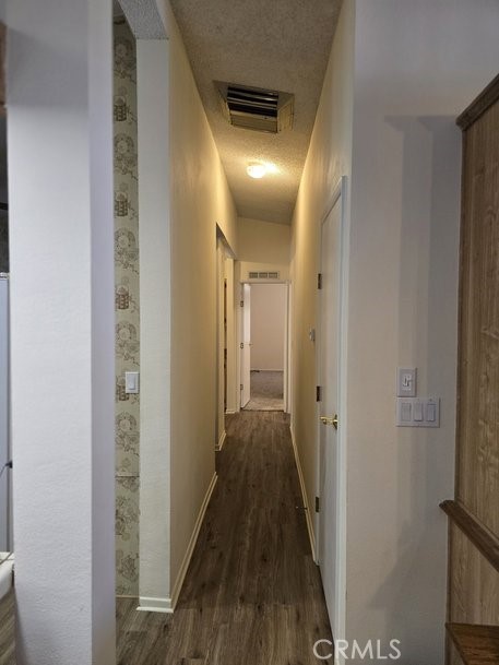 12618 3rd Street, Unit 63 Yucaipa, CA 92399 - Photo 31 of 65 a view of a hallway with wooden floor