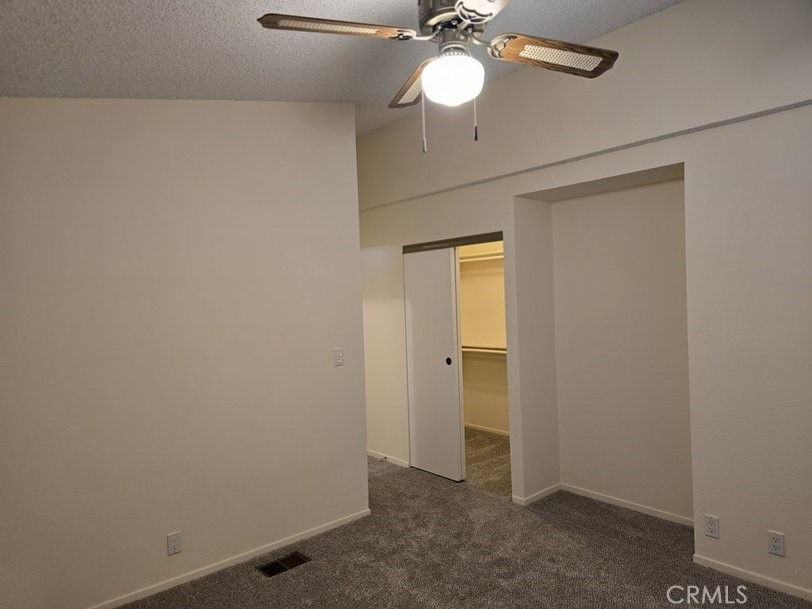 12618 3rd Street, Unit 63 Yucaipa, CA 92399 - Photo 33 of 65 a view of a room with a chandelier fan