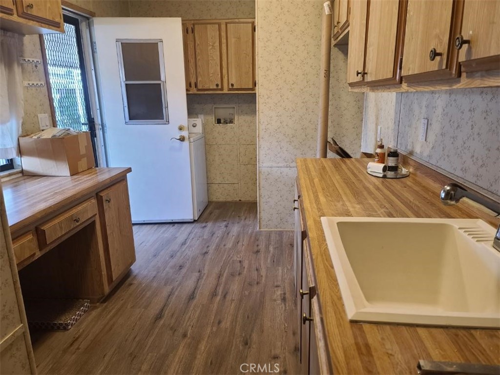 12618 3rd Street, Unit 63 Yucaipa, CA 92399 - Photo 40 of 65 a room with wooden floor and a fireplace