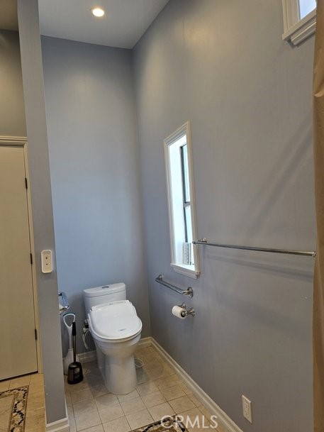12618 3rd Street, Unit 63 Yucaipa, CA 92399 - Photo 47 of 70 master bath toilet Bidet area, handicap bars