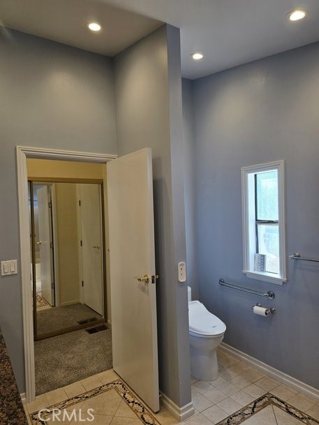 12618 3rd Street, Unit 63 Yucaipa, CA 92399 - Photo 48 of 65 a bathroom with a toilet a sink and shower