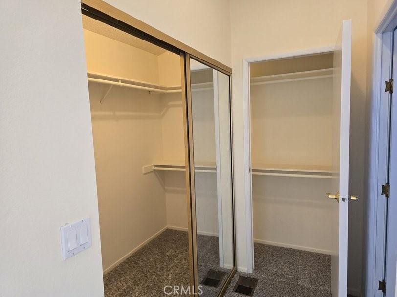 12618 3rd Street, Unit 63 Yucaipa, CA 92399 - Photo 52 of 65 walk in closet in master, with a second entrance
