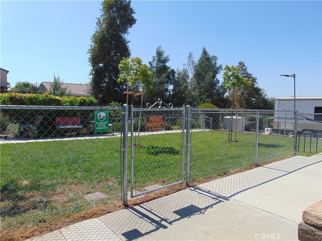 12618 3rd Street, Unit 63 Yucaipa, CA 92399 - Photo 64 of 65 a view of house with a backyard
