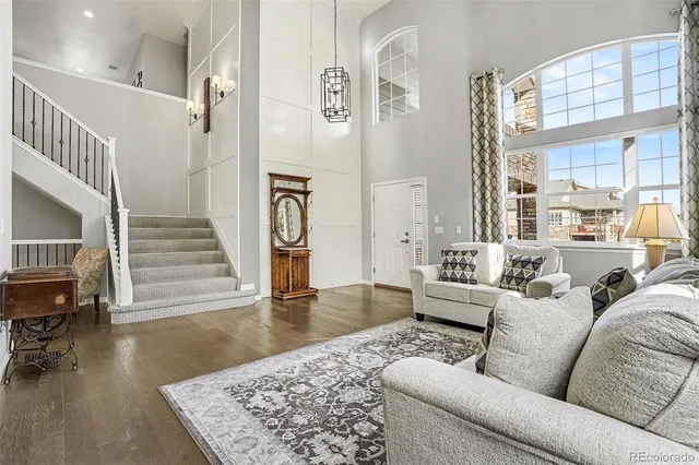 a living room with furniture and a rug