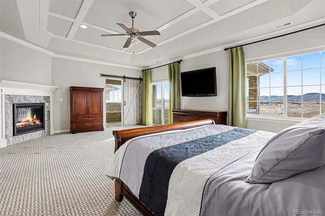 a bedroom with a large bed and a flat screen tv