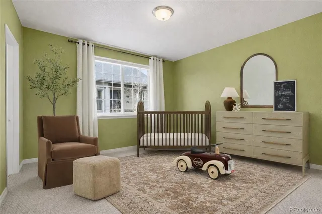 a view of a livingroom with furniture and a window