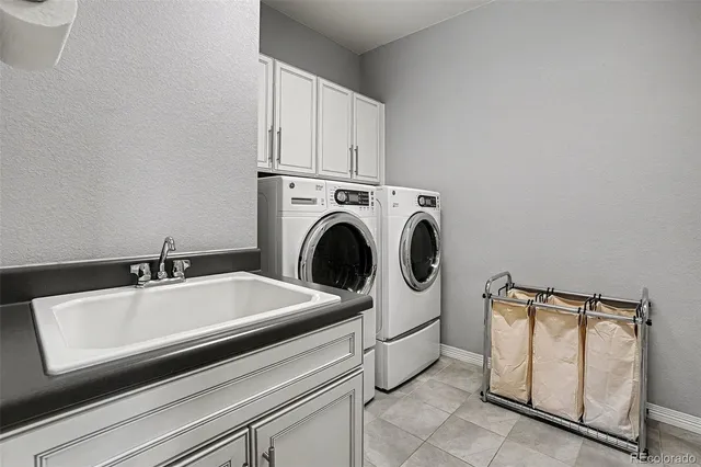 a close view of a sink and washer and dryer