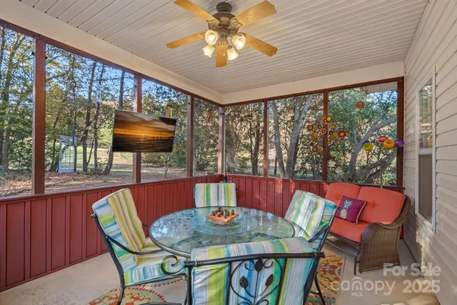 a view of a dining room with furniture window and outside view