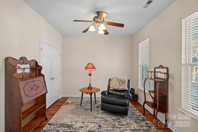a bedroom with furniture and a window