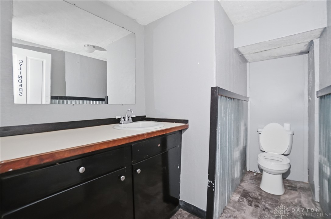 517 Broadway Street, Unit 515 Springfield, OH 45504 - Photo 13 of 29 This functional bathroom features a clean vanity and a toilet for essential comfort.