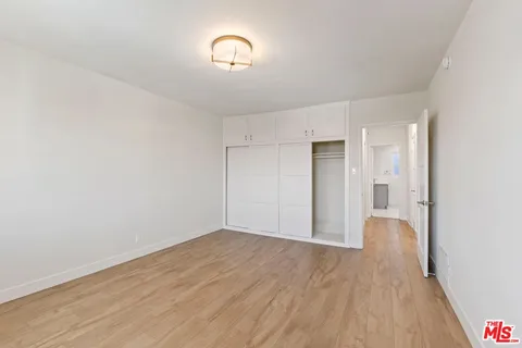 a view of a livingroom with wooden floor