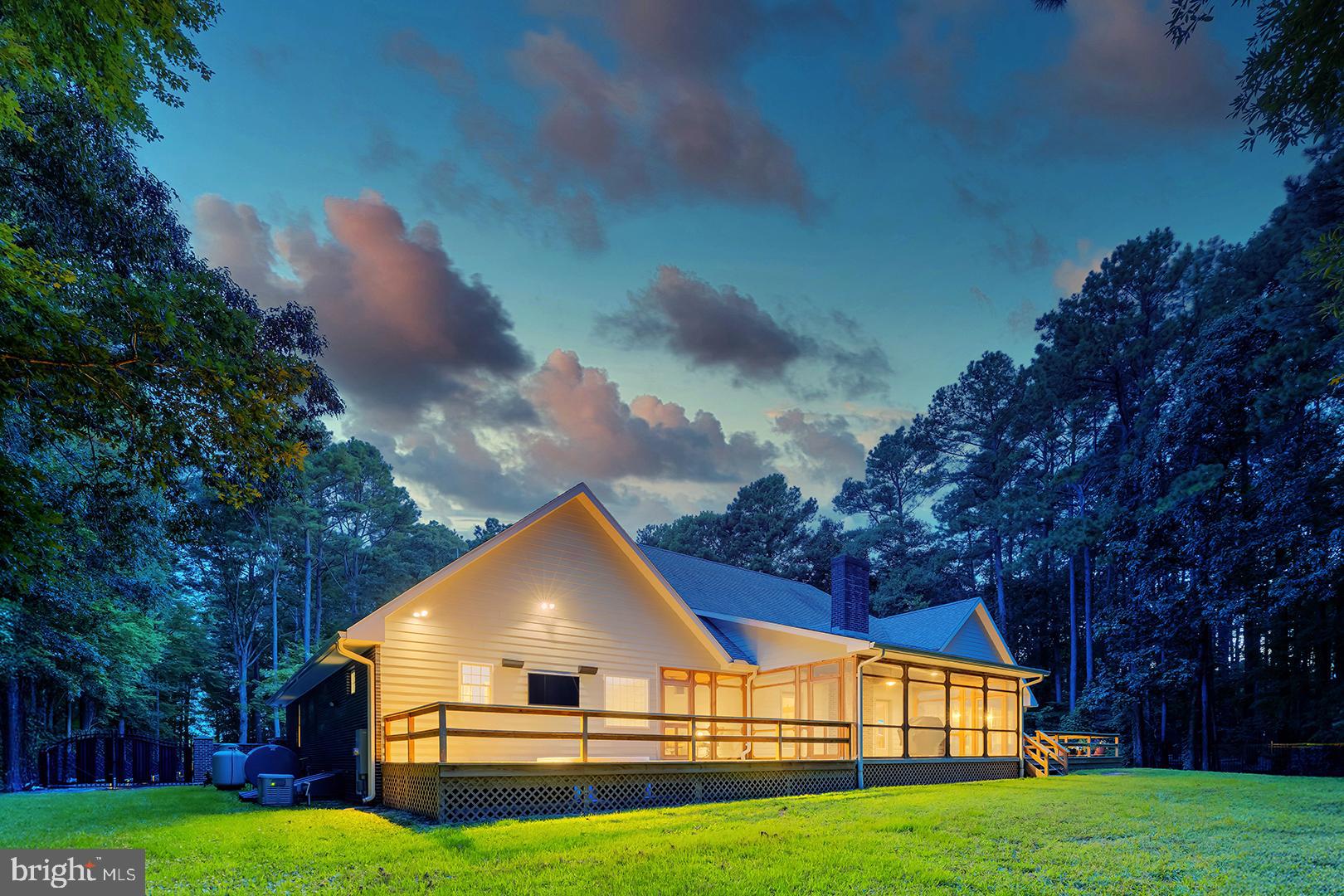 22095 Wilson Road Georgetown, DE 19947 - Photo 116 of 137 a view of a large house with a big yard and large trees