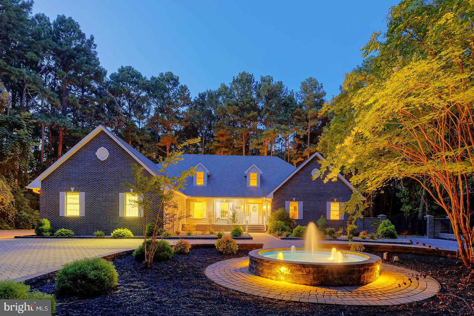 22095 Wilson Road Georgetown, DE 19947 - Photo 12 of 137 a view of a house with swimming pool and sitting area