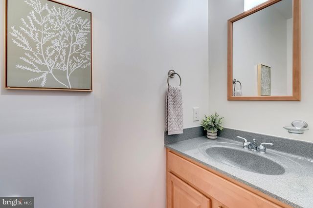 a kitchen with stainless steel appliances a sink and cabinets