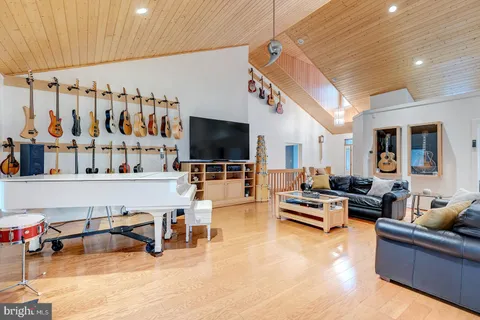 a kitchen with stainless steel appliances granite countertop a sink a stove and a window