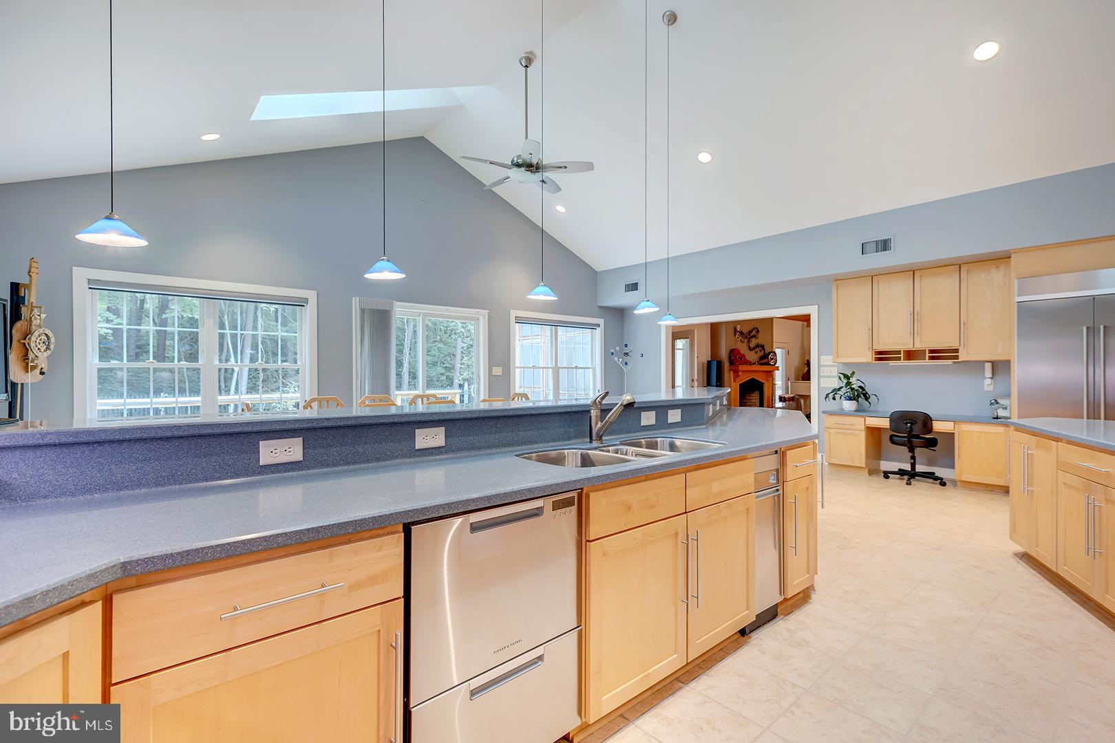 22095 Wilson Road Georgetown, DE 19947 - Photo 34 of 137 a kitchen with stainless steel appliances granite countertop a sink a stove and a window
