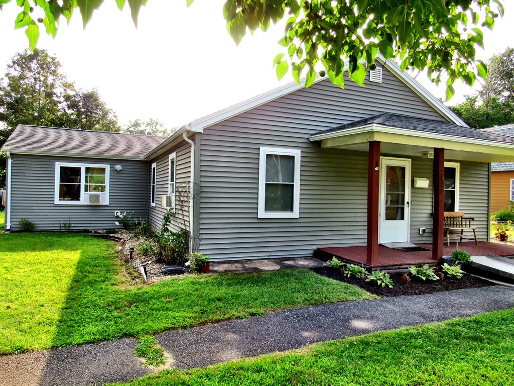 2028 East Street Three Rivers, MA 01080 - Photo 1 of 31 a front view of a house with garden