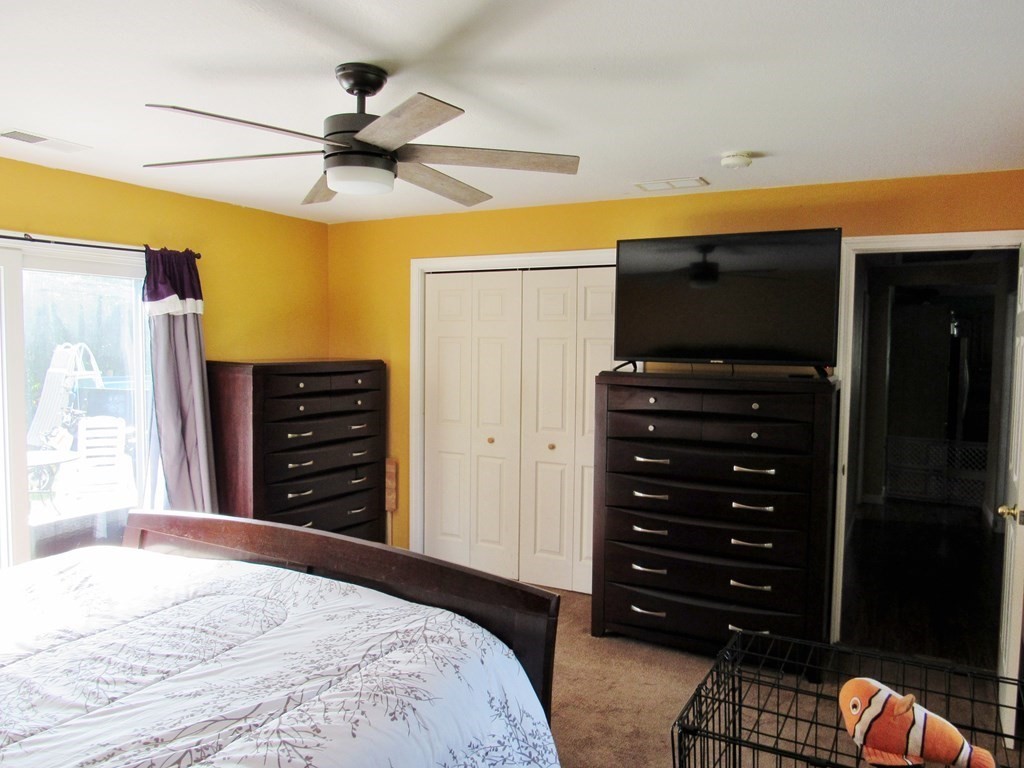 2028 East Street Three Rivers, MA 01080 - Photo 12 of 31 a bedroom with a bed and a chandelier