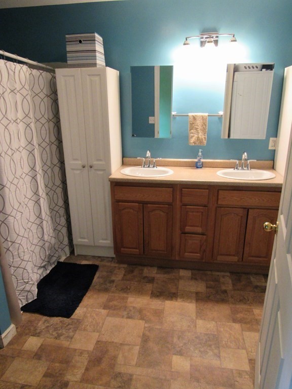 2028 East Street Three Rivers, MA 01080 - Photo 17 of 31 a bathroom with a sink and a mirror