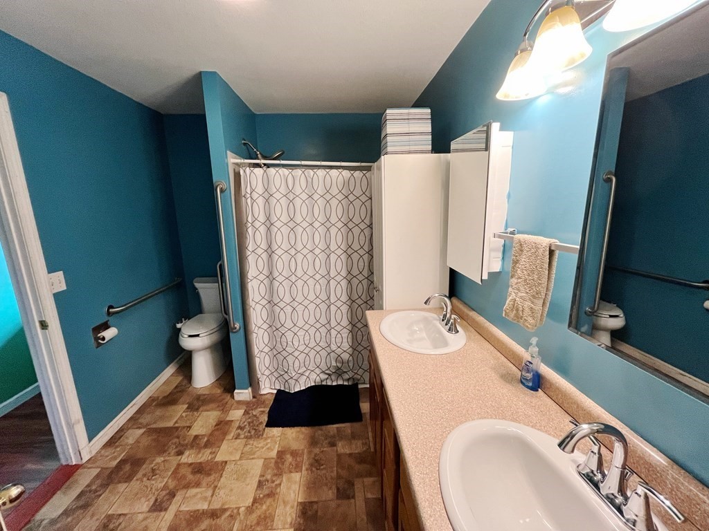 2028 East Street Three Rivers, MA 01080 - Photo 18 of 31 a bathroom with a sink and a mirror
