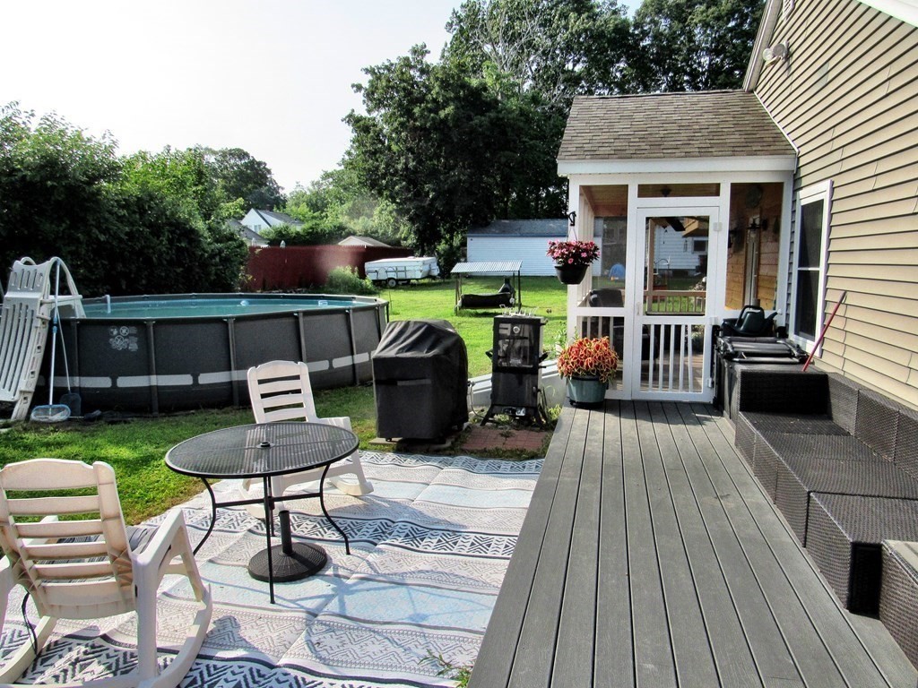 2028 East Street Three Rivers, MA 01080 - Photo 25 of 31 a view of a chairs and table in the patio in front of house