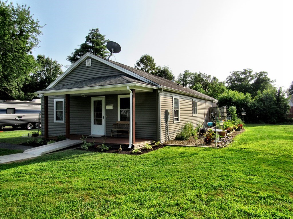 2028 East Street Three Rivers, MA 01080 - Photo 29 of 31 a front view of a house with garden