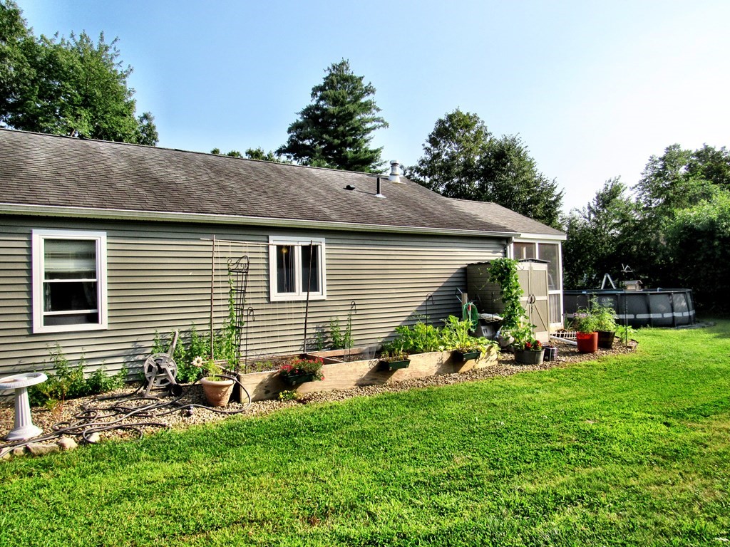 2028 East Street Three Rivers, MA 01080 - Photo 30 of 31 a front view of house with yard and seating space