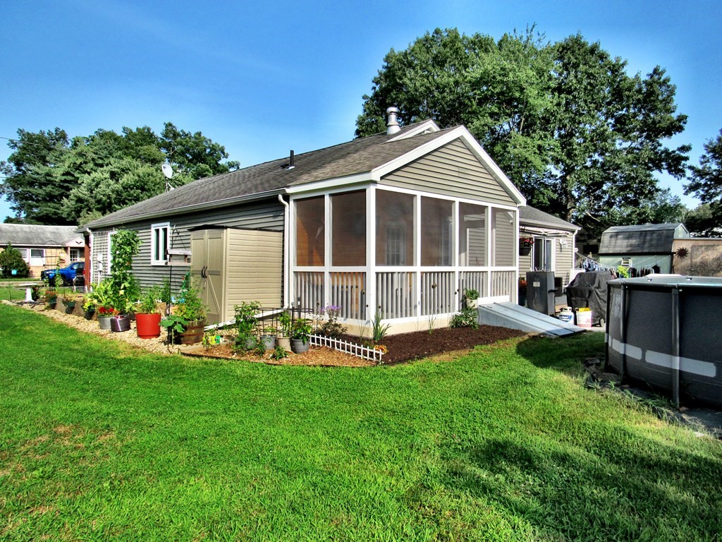2028 East Street Three Rivers, MA 01080 - Photo 3 of 31 a view of a house with backyard sitting area and garden