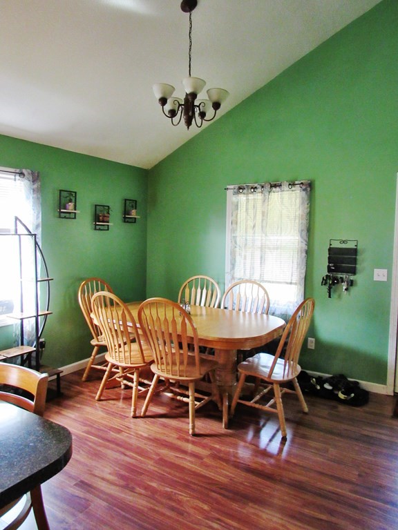 2028 East Street Three Rivers, MA 01080 - Photo 4 of 31 a dining room with furniture a rug and wooden floor