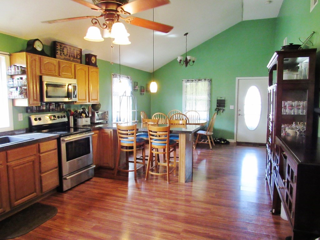 2028 East Street Three Rivers, MA 01080 - Photo 5 of 31 a view of a dining room with furniture and wooden floor