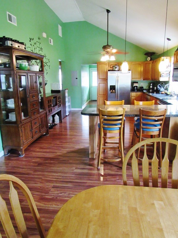2028 East Street Three Rivers, MA 01080 - Photo 6 of 31 a dining room with furniture a chandelier and wooden floor