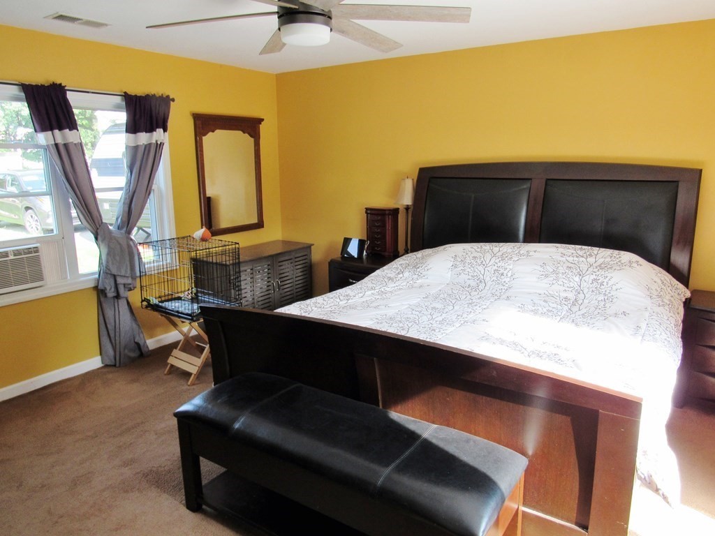 2028 East Street Three Rivers, MA 01080 - Photo 10 of 31 a living room with table chairs and a table